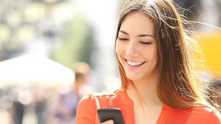 Person viewing available balance on a phone
