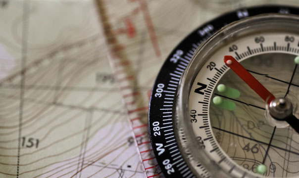 Photo of a map and compass closeup